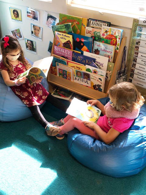 These girls are having fun in the reading room